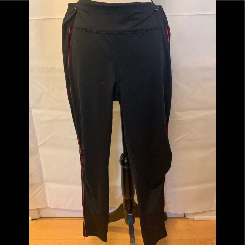 Danskin black leggings with pink pin stripe down side. Size L NWOT